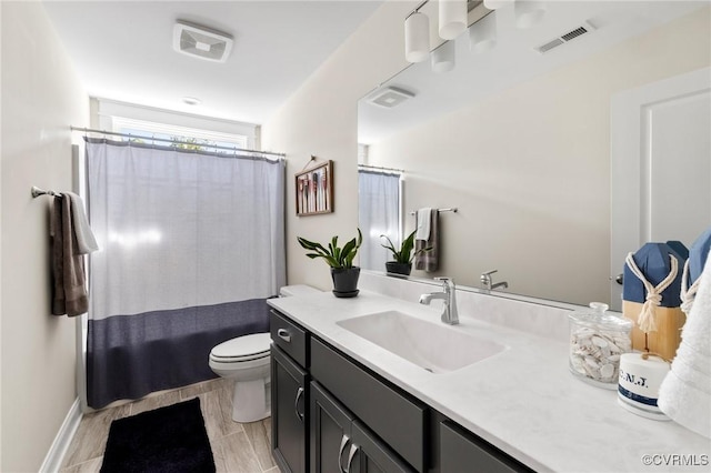 full bath featuring toilet, visible vents, curtained shower, and vanity