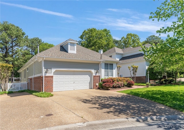 10932 Dominion Fairways Ln, Glen Allen, VA 23059 - view of front of property featuring brick siding, fence, an attached garage, concrete driveway, and a front yard