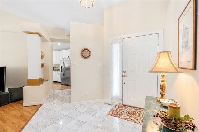 10932 Dominion Fairways Ln, Glen Allen, VA 23059 - foyer with marble finish floor, baseboards, and a high ceiling