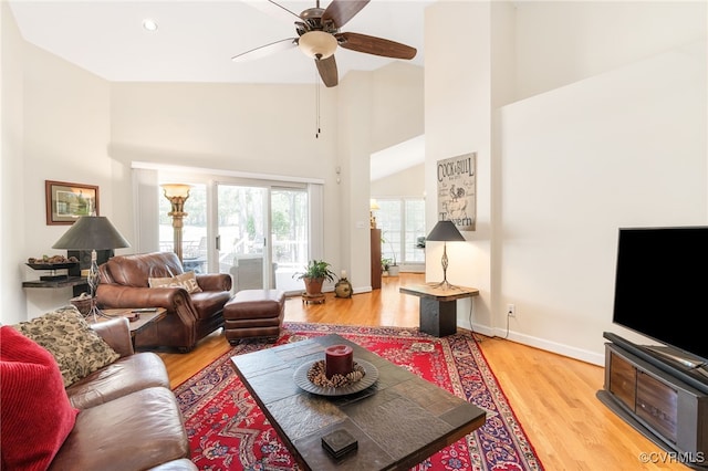 10932 Dominion Fairways Ln, Glen Allen, VA 23059 - living room with baseboards, ceiling fan, light wood-style floors, and high vaulted ceiling