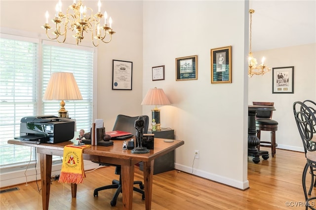 10932 Dominion Fairways Ln, Glen Allen, VA 23059 - home office with light wood-style flooring, a healthy amount of sunlight, visible vents, baseboards, and a chandelier
