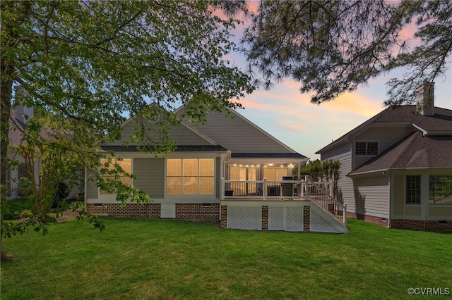 10932 Dominion Fairways Ln, Glen Allen, VA 23059 - back of house at dusk with a yard, a deck, crawl space, and stairway
