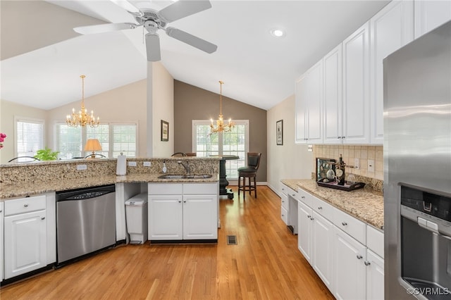 10932 Dominion Fairways Ln, Glen Allen, VA 23059 - kitchen with white cabinetry, light wood-style floors, stainless steel appliances, and a sink