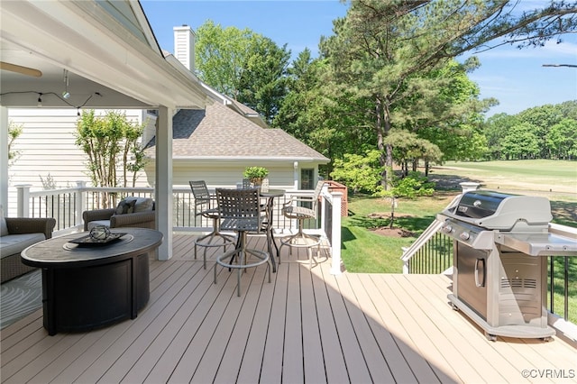 10932 Dominion Fairways Ln, Glen Allen, VA 23059 - wooden deck with area for grilling, a yard, a fire pit, and outdoor dining space