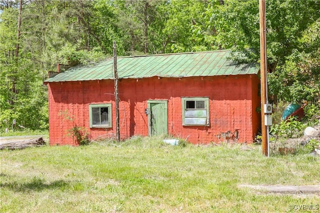 exterior space featuring a wooded view