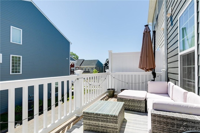 balcony featuring a residential view and outdoor lounge area