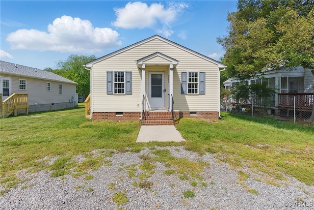 view of front of home with crawl space and a front yard