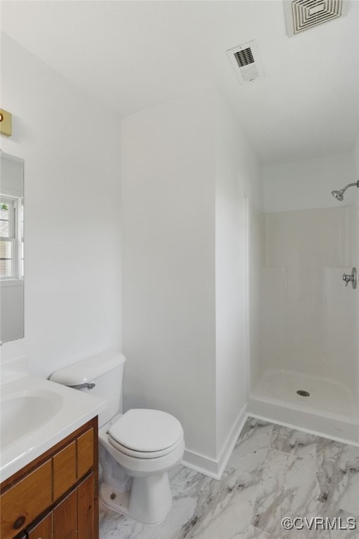 full bathroom featuring marble finish flooring, a shower, vanity, toilet, and baseboards