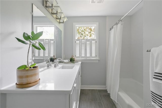 3454 Warner Rd, Richmond, VA 23225 - full bath with healthy amount of natural light, baseboards, vanity, and shower / bath combination with curtain