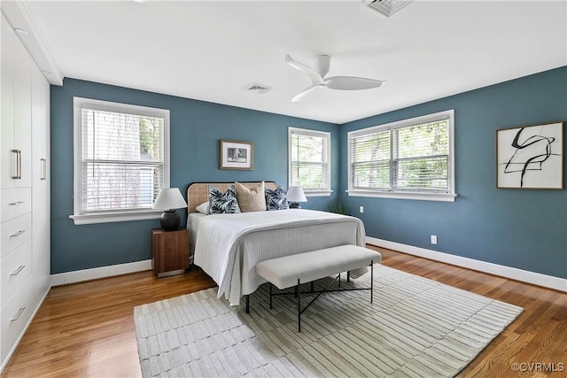 3454 Warner Rd, Richmond, VA 23225 - bedroom with multiple windows, wood finished floors, and baseboards