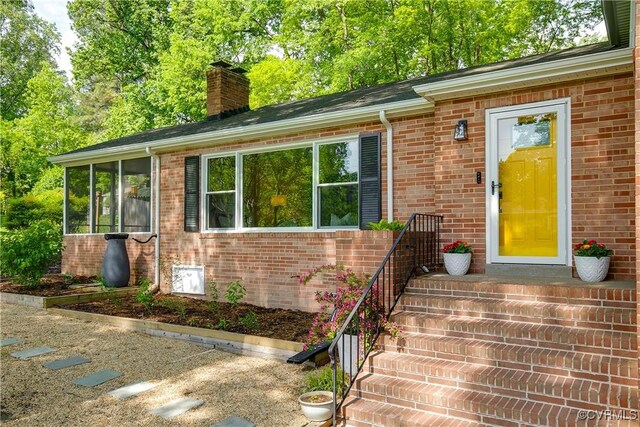 3454 Warner Rd, Richmond, VA 23225 - entrance to property with a chimney and brick siding