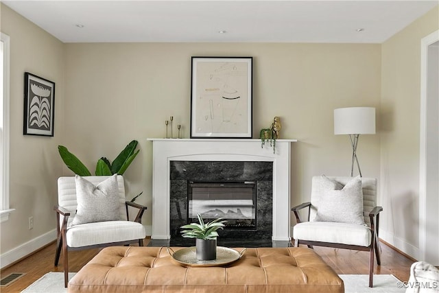 3454 Warner Rd, Richmond, VA 23225 - sitting room with wood finished floors, baseboards, and a high end fireplace