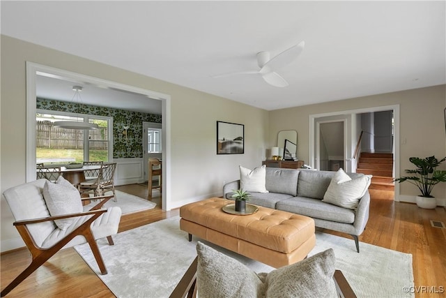 3454 Warner Rd, Richmond, VA 23225 - living room with baseboards, stairway, wood finished floors, and ceiling fan