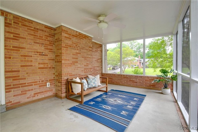 3454 Warner Rd, Richmond, VA 23225 - sunroom / solarium featuring a ceiling fan, concrete flooring, and brick wall