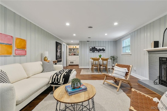 3454 Warner Rd, Richmond, VA 23225 - living room with crown molding, wood finished floors, baseboards, a fireplace, and recessed lighting