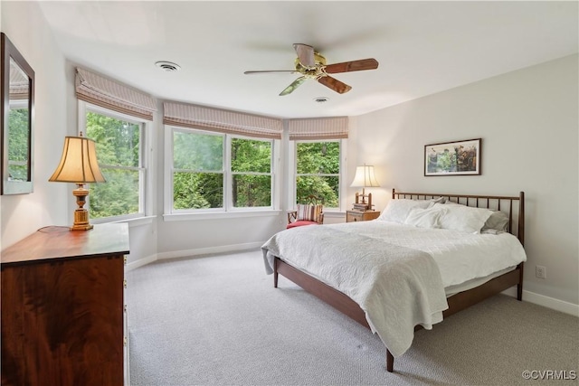 bedroom featuring baseboards, a ceiling fan, and carpet floors
