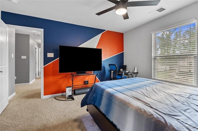 bedroom featuring baseboards, carpet, a ceiling fan, and visible vents