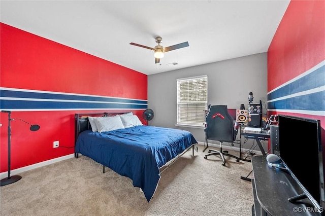 carpeted bedroom with baseboards, ceiling fan, and visible vents