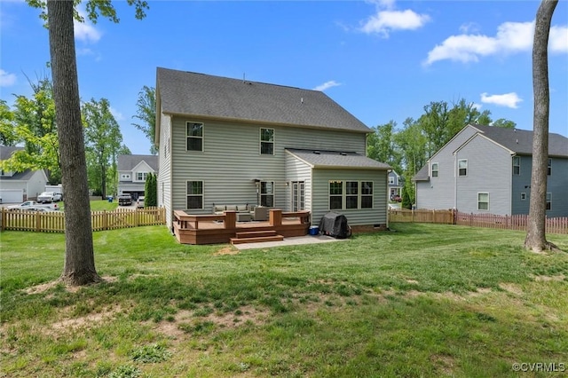rear view of property with a lawn, fence, and an outdoor hangout area
