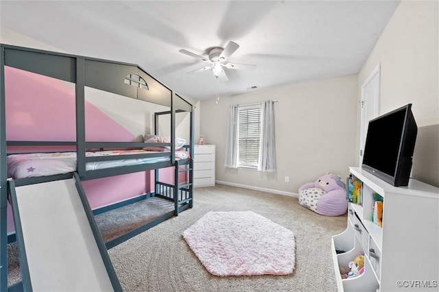 carpeted bedroom with baseboards, a ceiling fan, and lofted ceiling