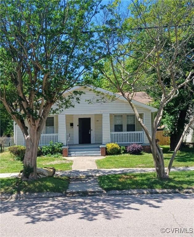 130 Elm St, Petersburg, VA 23803 - view of front of house with a porch and a front yard