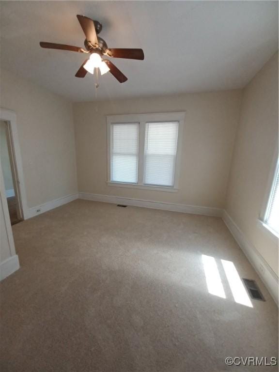 130 Elm St, Petersburg, VA 23803 - unfurnished room featuring light colored carpet, ceiling fan, and baseboards