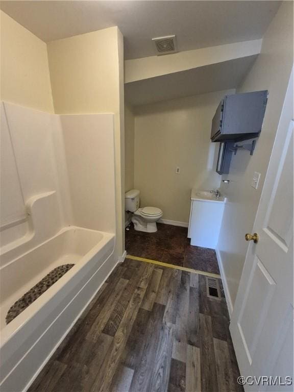130 Elm St, Petersburg, VA 23803 - full bathroom with toilet, vanity, wood finished floors, and baseboards