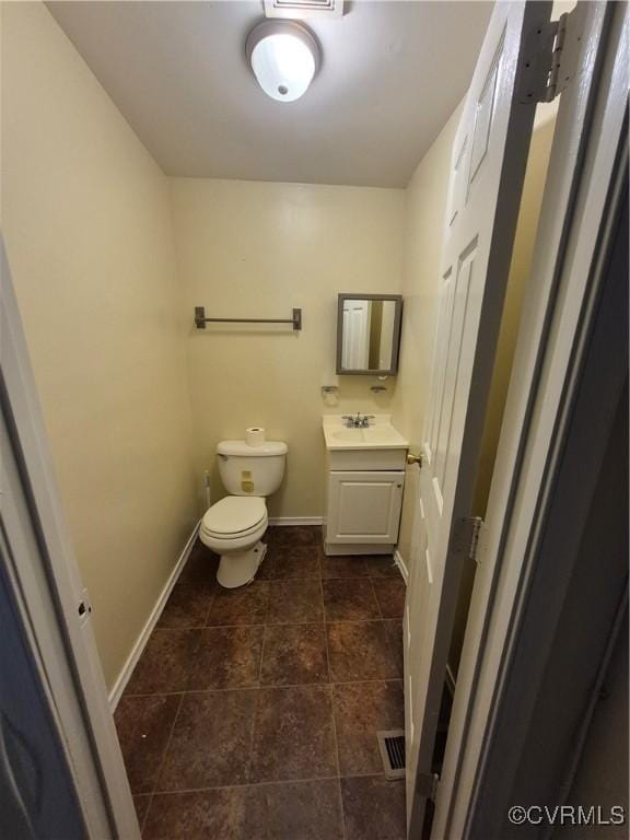 130 Elm St, Petersburg, VA 23803 - half bath featuring toilet, vanity, and baseboards