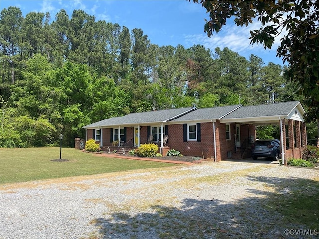 1195 Stingy Lane Rd, Blackstone, VA 23824 - ranch-style house featuring a front lawn, covered porch, gravel driveway, an attached carport, and brick siding