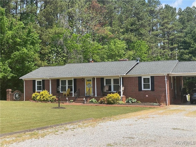1195 Stingy Lane Rd, Blackstone, VA 23824 - single story home with a porch, brick siding, a front yard, and gravel driveway