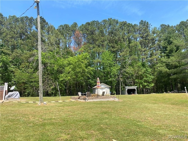 1195 Stingy Lane Rd, Blackstone, VA 23824 - view of yard with an outdoor structure and a view of trees