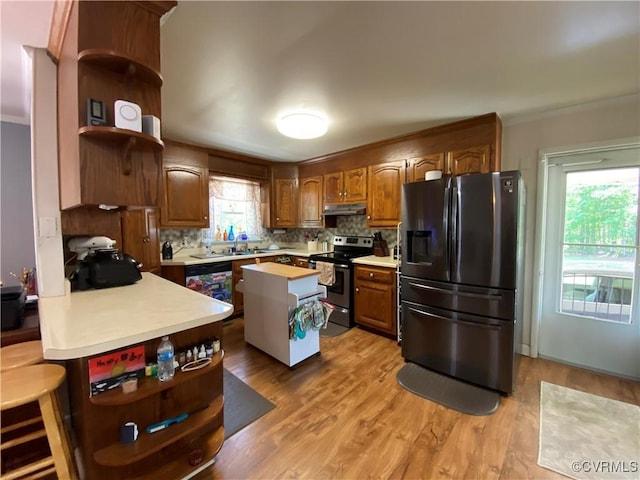 1195 Stingy Lane Rd, Blackstone, VA 23824 - kitchen featuring open shelves, black fridge with ice dispenser, dishwashing machine, stainless steel electric stove, and under cabinet range hood