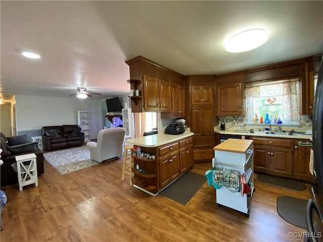 1195 Stingy Lane Rd, Blackstone, VA 23824 - kitchen with open shelves, dark wood finished floors, a center island, a ceiling fan, and open floor plan