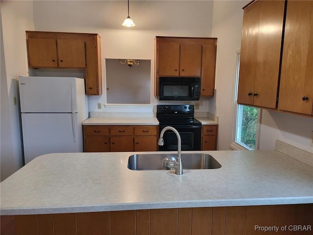 80 Anchorage Dr, Newport News, VA 23602 - kitchen featuring a sink, light countertops, brown cabinetry, and black appliances