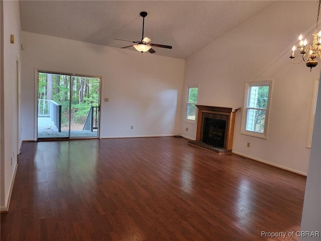 80 Anchorage Dr, Newport News, VA 23602 - unfurnished living room with a fireplace, ceiling fan with notable chandelier, baseboards, dark wood-type flooring, and vaulted ceiling