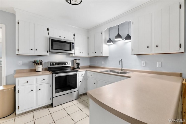 kitchen featuring white cabinets, light tile patterned flooring, a sink, light countertops, and stainless steel appliances
