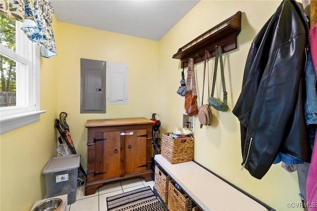 mudroom with light tile patterned floors and electric panel