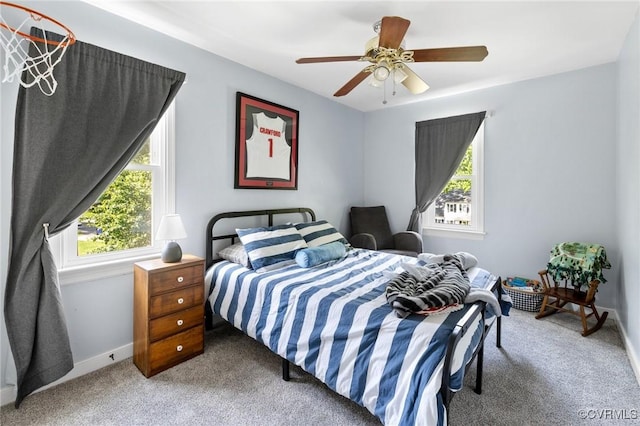 bedroom with baseboards, carpet, and ceiling fan