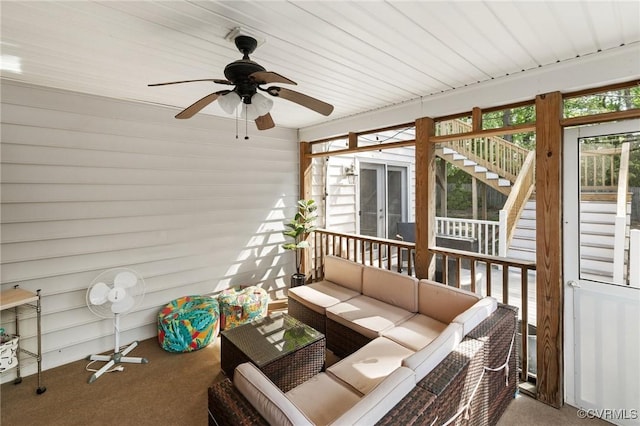 sunroom with an outdoor living space, a ceiling fan, and plenty of natural light