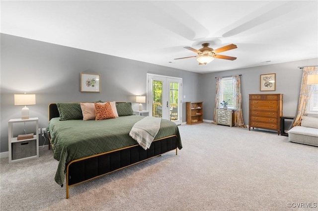 carpeted bedroom with french doors, a ceiling fan, baseboards, and access to exterior