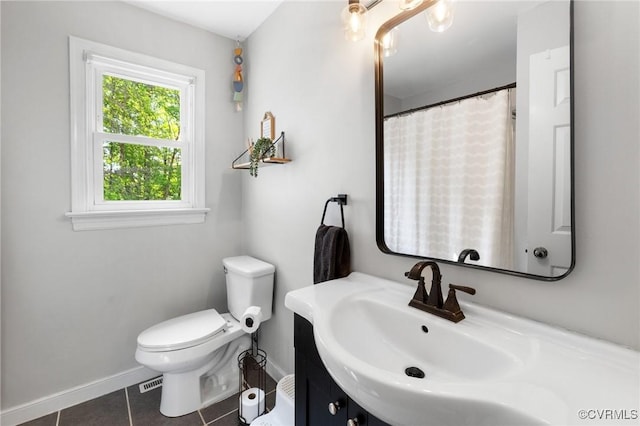 full bathroom with baseboards, tile patterned flooring, vanity, and toilet
