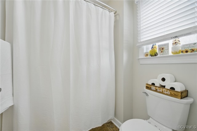full bathroom featuring toilet