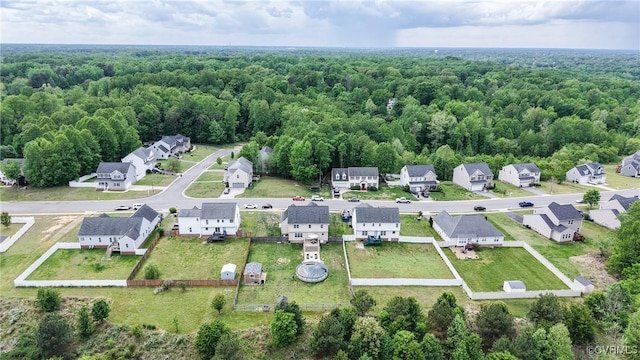 aerial view featuring a residential view and a forest view