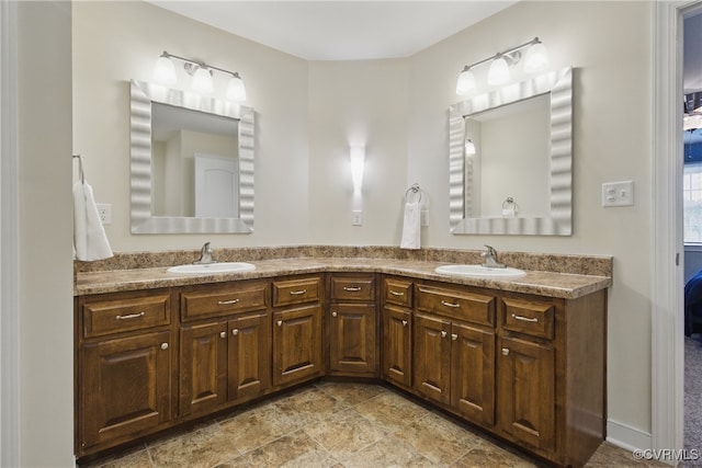 bathroom featuring double vanity and a sink