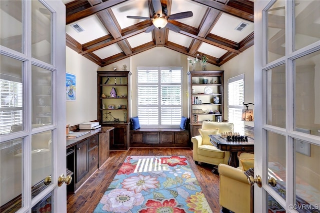 living area with vaulted ceiling with beams, a ceiling fan, dark wood-style floors, and visible vents