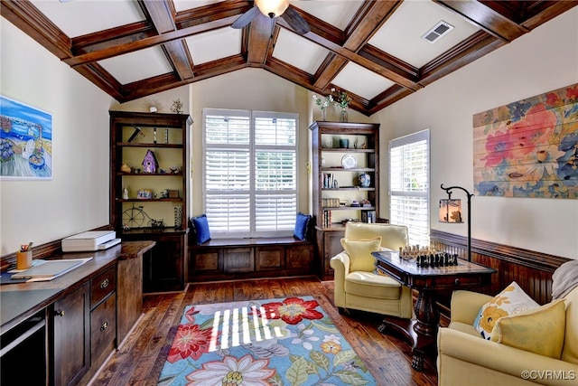 living area featuring visible vents, a ceiling fan, dark wood finished floors, and plenty of natural light