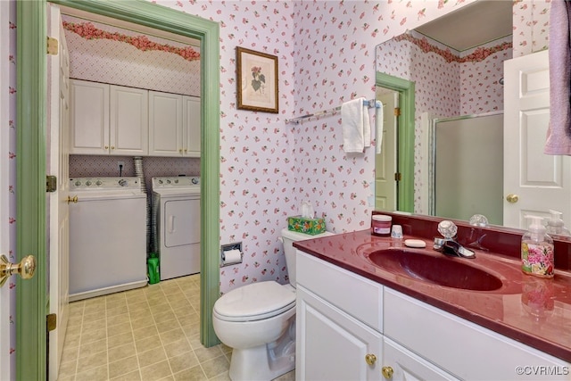 bathroom featuring separate washer and dryer, a stall shower, and wallpapered walls