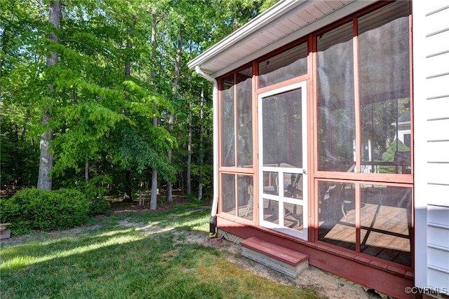 view of side of property with a sunroom