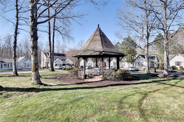 view of home's community with a gazebo, a lawn, and a residential view