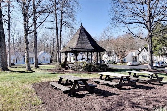 view of home's community with a yard, a gazebo, and a residential view
